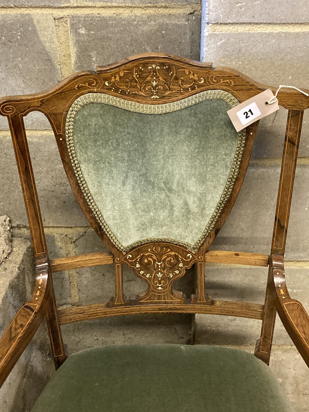 An Edwardian bone and marquetry-inlaid rosewood elbow chair, on square tapered legs with castors, width 55cm, height 89cm